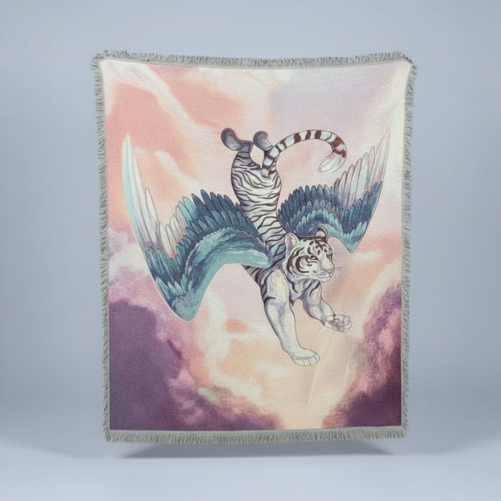 Blanket with a fantasy design of a winged tiger against a pastel sky.